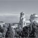 Black and white photo of a city view with a large cathedral